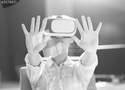 Image of Young woman using vr glasses