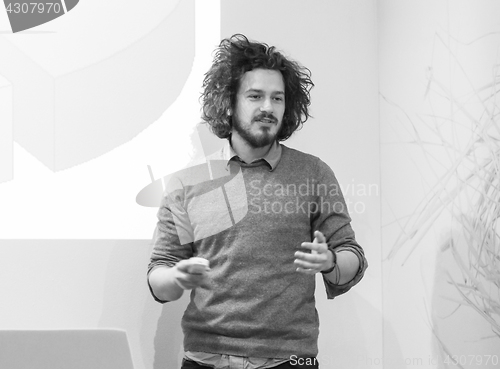 Image of Young teacher in academy classroom