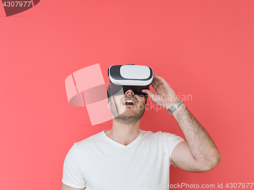Image of young man using VR headset glasses of virtual reality