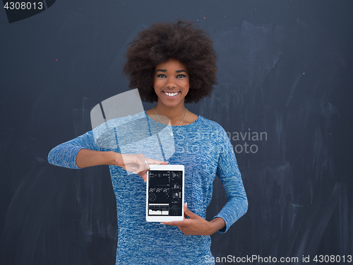 Image of Happy African American Woman Using Digital Tablet