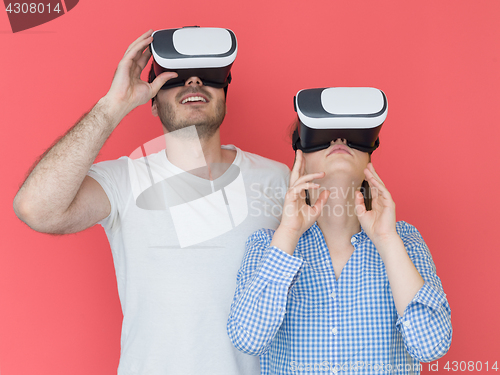 Image of happy couple using VR-headset glasses of virtual reality