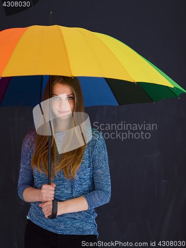 Image of handsome woman with a colorful umbrella