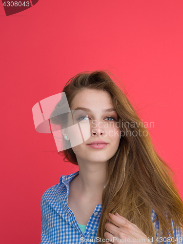 Image of woman playing with her long silky hair