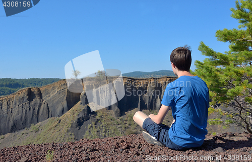 Image of Teen boy enjoy mountain view