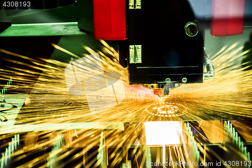 Image of CNC Laser cutting of metal, modern industrial technology.