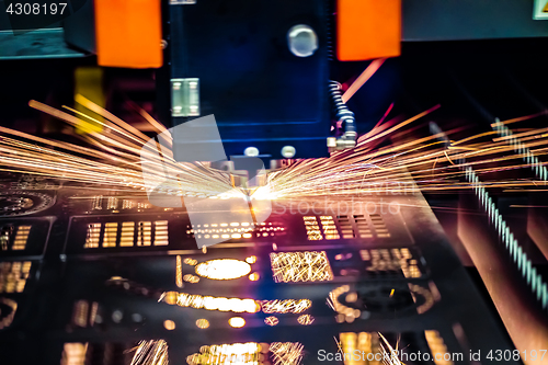 Image of CNC Laser cutting of metal, modern industrial technology.