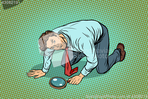 Image of Businessman investigator looking with magnifying glass