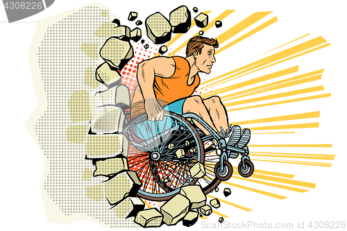 Image of Caucasian male athlete in a wheelchair punches the wall