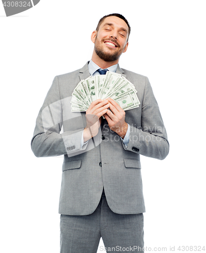 Image of smiling businessman with american dollar money