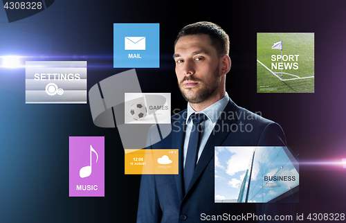 Image of businessman in suit over black