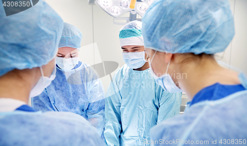 Image of group of surgeons in operating room at hospital