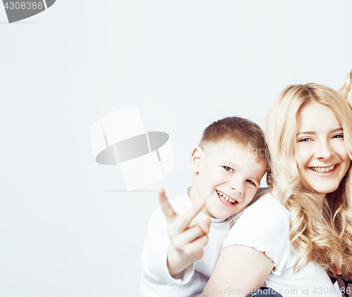 Image of young modern blond curly mother with cute son together happy smiling family posing cheerful on white background, lifestyle people concept, sister and brother friends 