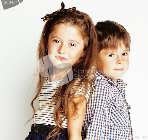 Image of little cute boy girl hugging playing on white background, happy family close up isolated. brother and sister smiling