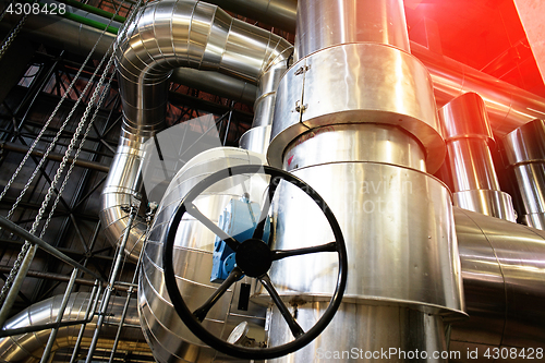 Image of Equipment, cables and piping as found inside of a modern industr