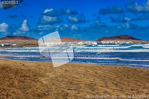 Image of Surfers and kiters in the water on Famara beach, Lanzarote