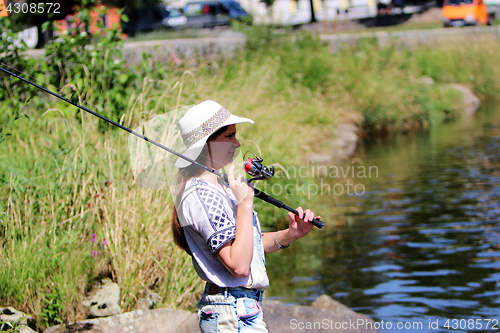 Image of Woman with freckles and hot pants