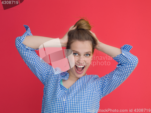 Image of woman playing with her long silky hair