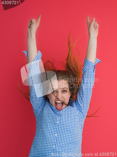 Image of woman playing with her long silky hair