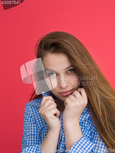 Image of woman playing with her long silky hair