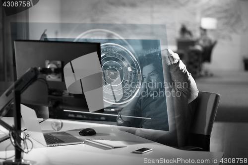 Image of businessman relaxing at the desk