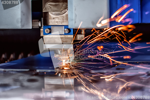 Image of CNC Laser cutting of metal, modern industrial technology.