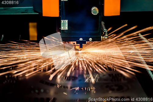 Image of CNC Laser cutting of metal, modern industrial technology.