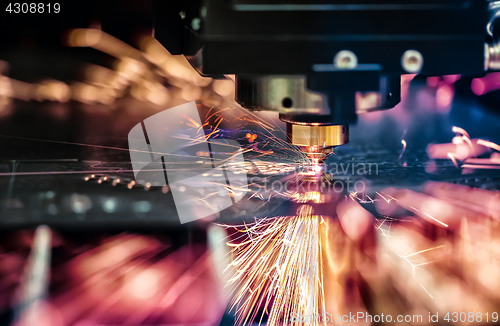 Image of CNC Laser cutting of metal, modern industrial technology.