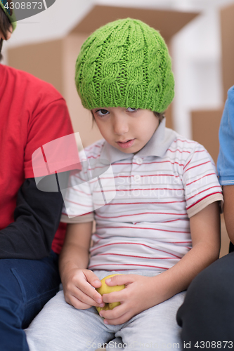 Image of boys with cardboard boxes around them