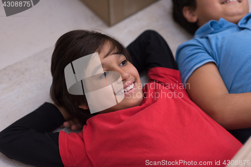 Image of young boys having fun on the floor