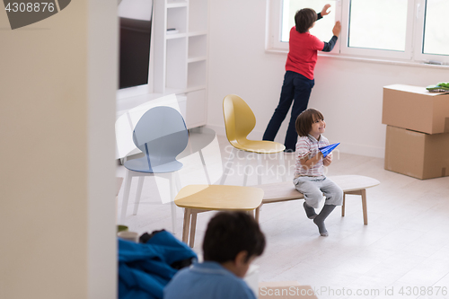 Image of boys in a new modern home