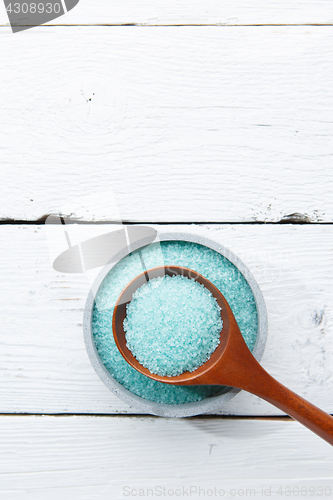 Image of Blue salt in wooden spoon