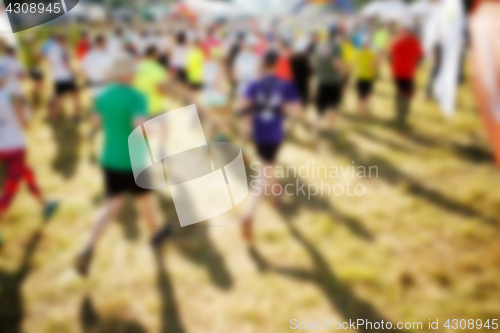 Image of Defocused photo of running athletes