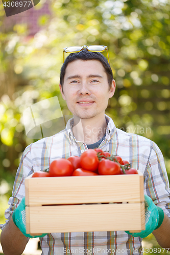 Image of Portrait of man with tomato