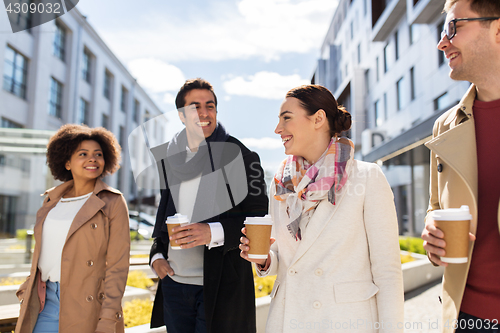 Image of group of people or friends with coffee in city