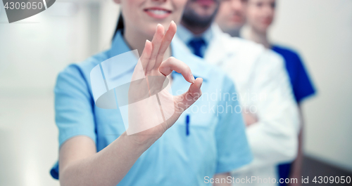 Image of close up of doctors at hospital showing ok sign