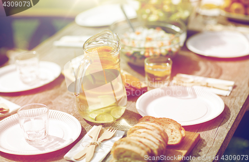 Image of table with food for dinner at summer garden party