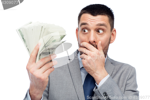 Image of smiling businessman with american dollar money