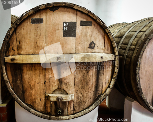 Image of wood wine barrels in a winery