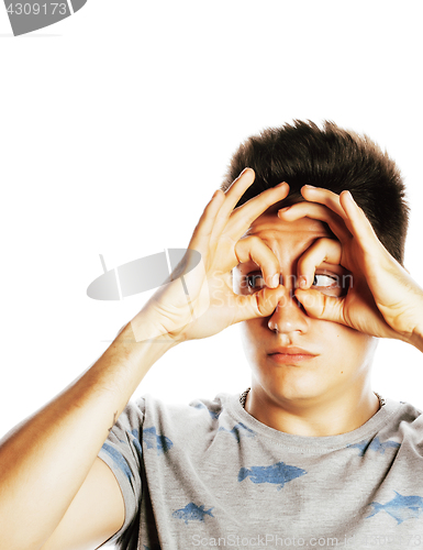 Image of young pretty man isolated showing two ok signs smiling close up