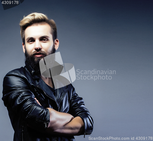 Image of portrait of young bearded hipster guy on gray dark background close up, brutal modern man, lifestyle people concept