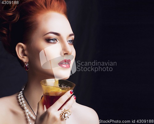 Image of beauty stylish redhead woman with hairstyle and manicure wearing