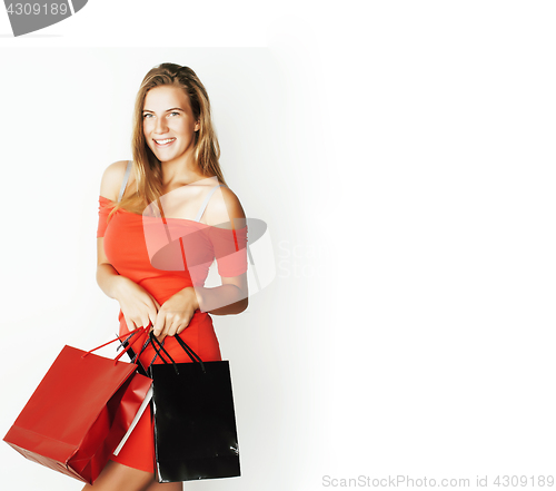Image of young modern blond woman with diverse bags posing emotional on white background, sale, lifestyle people concept 
