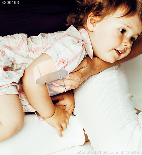 Image of pretty real normal mother with cute blond little daughter close up isolated on white background, lifestyle real people concept