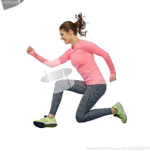 Image of happy smiling sporty young woman jumping in air