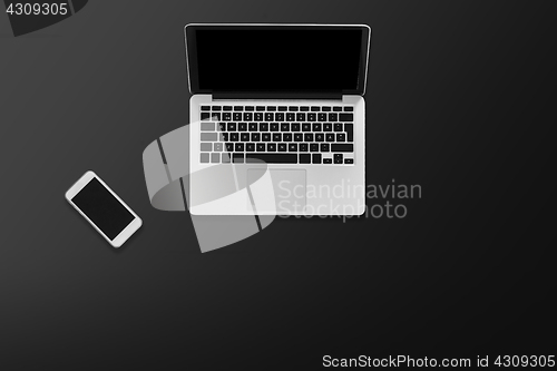Image of laptop computer and smartphone top view