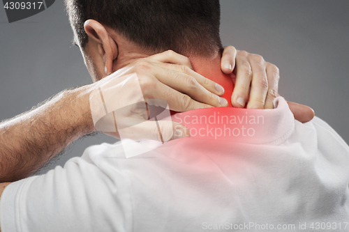 Image of close up of man suffering from neck pain