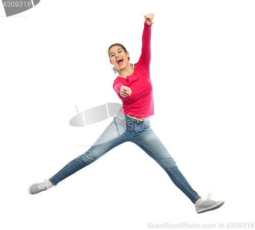 Image of smiling young woman jumping in air