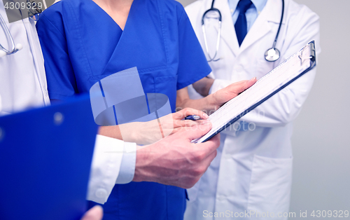 Image of close up of doctors with clipboard at hospital