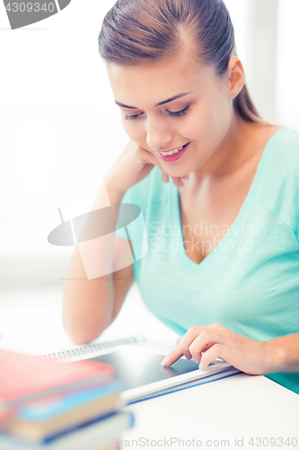 Image of attractive student girl using tablet pc