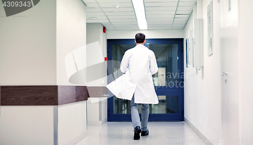 Image of medic or doctor walking along hospital corridor